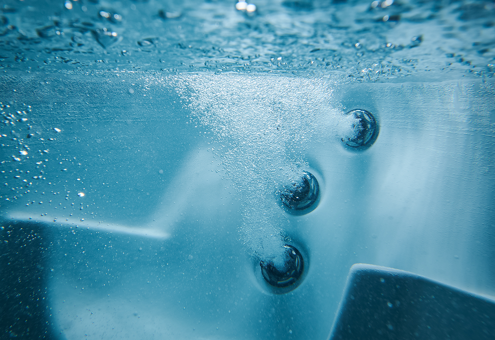 underwater shot of hot tub jets turned on