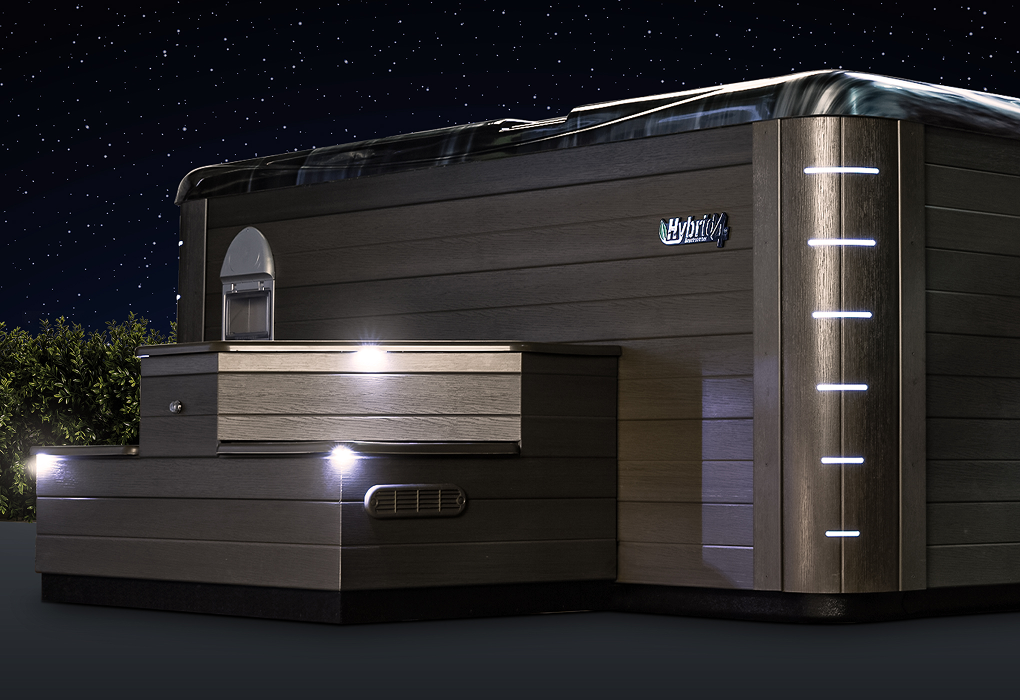 beachcomber hot tub in a backyard on a dark, starry night