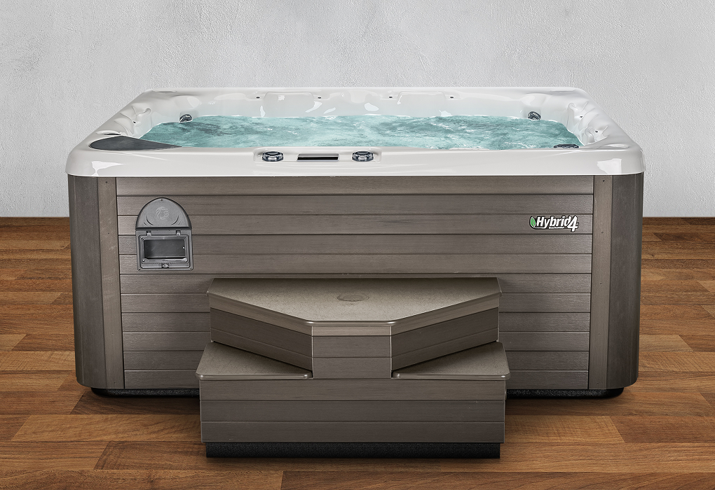 hybrid4 hot tub on wooden floor with white background