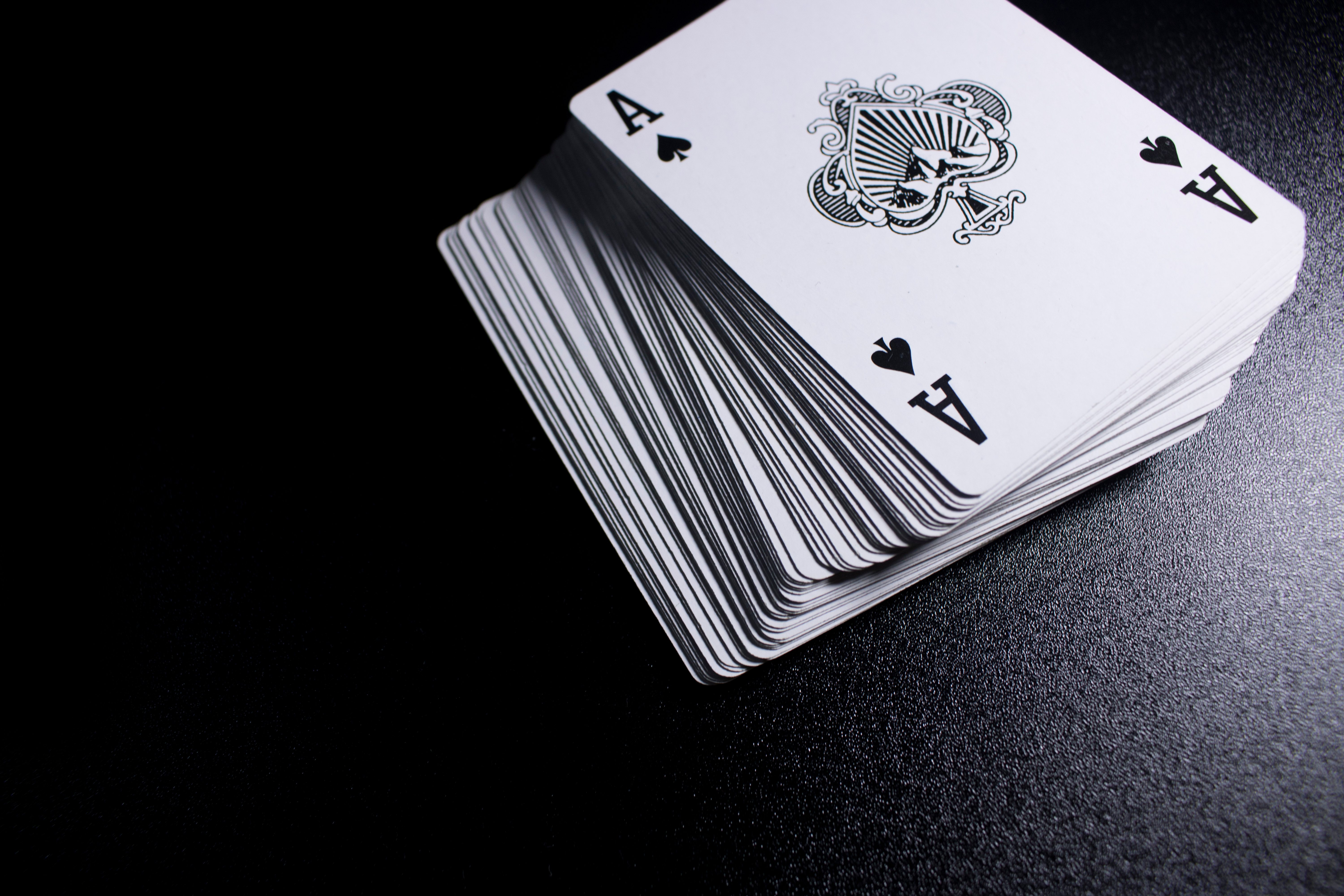 deck of cards with a black background