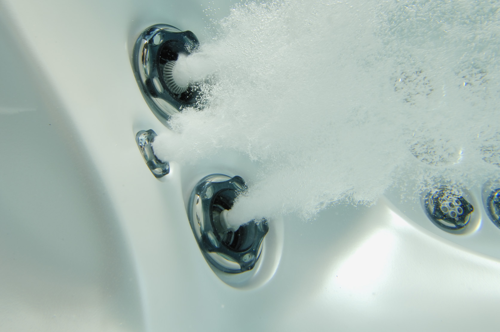 hot tub jet on under water creating bubbles