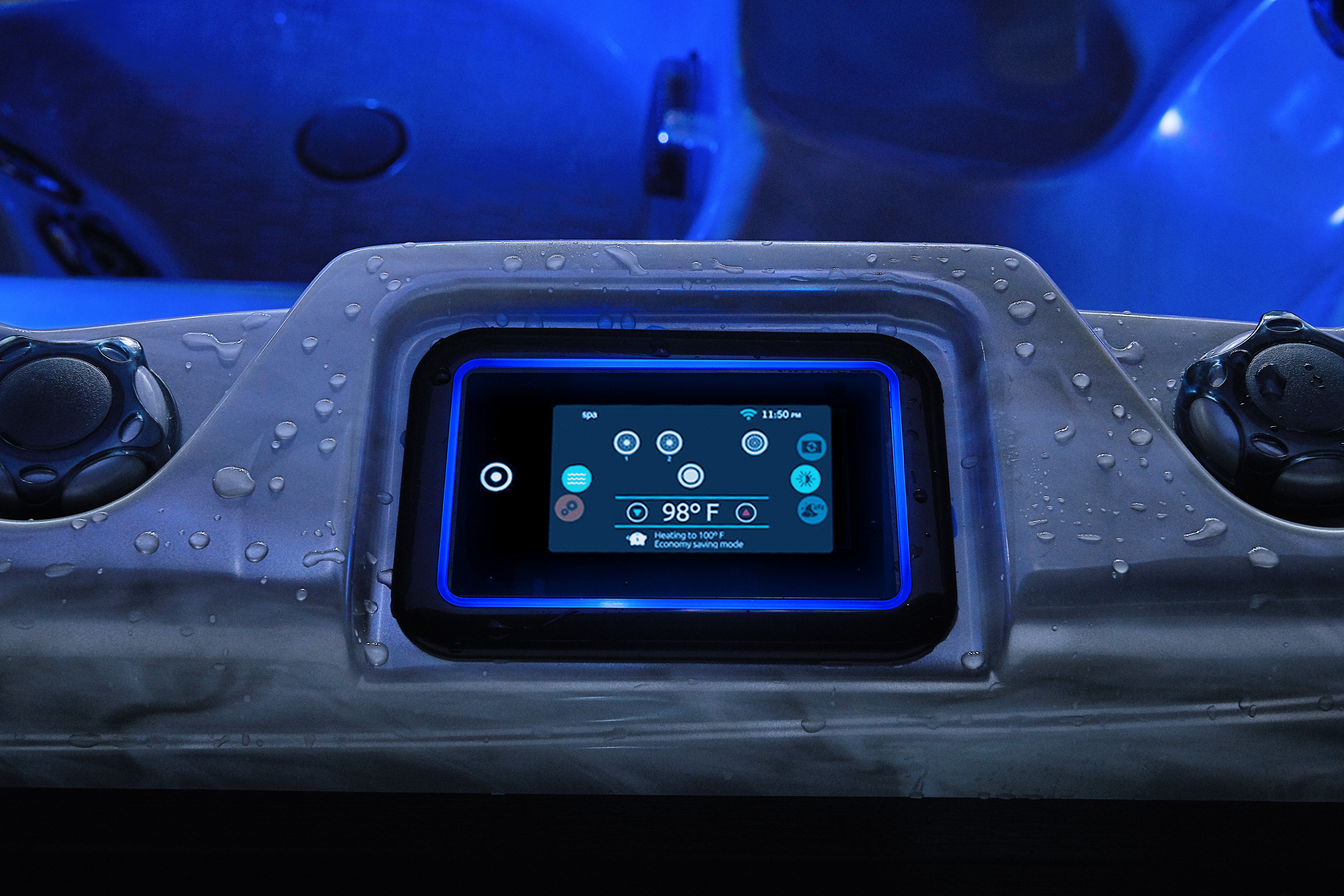 beachcomber hot tub control panel lit up on hot tub, dark blue lighting in the background