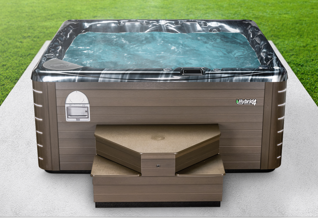 beachcomber hybrid4 hot tub with marquina acrylic on a slab of concrete