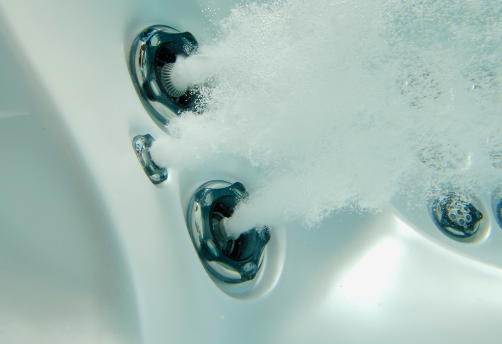 under water shot of a beachcomber hot tub showing the flexjet hot tub jets turned on and the bubbles of water as they work