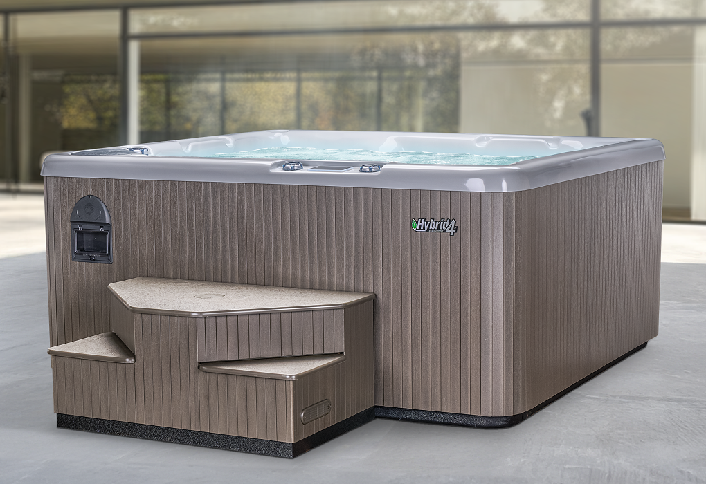 beachcomber hot tub outside in front of a home with glass door