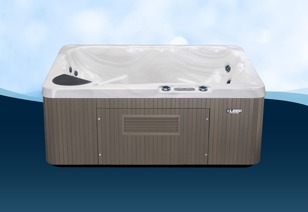 beachcomber plug n play hot tub on a blue background