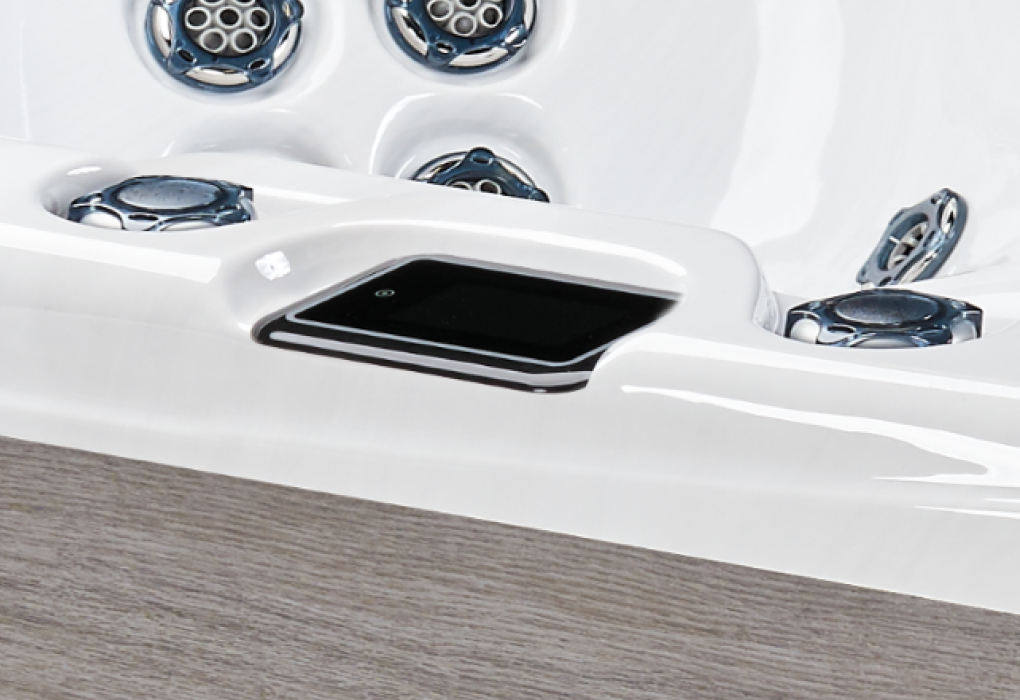 angled photo of the side of a hot tub with the easy touch control panel