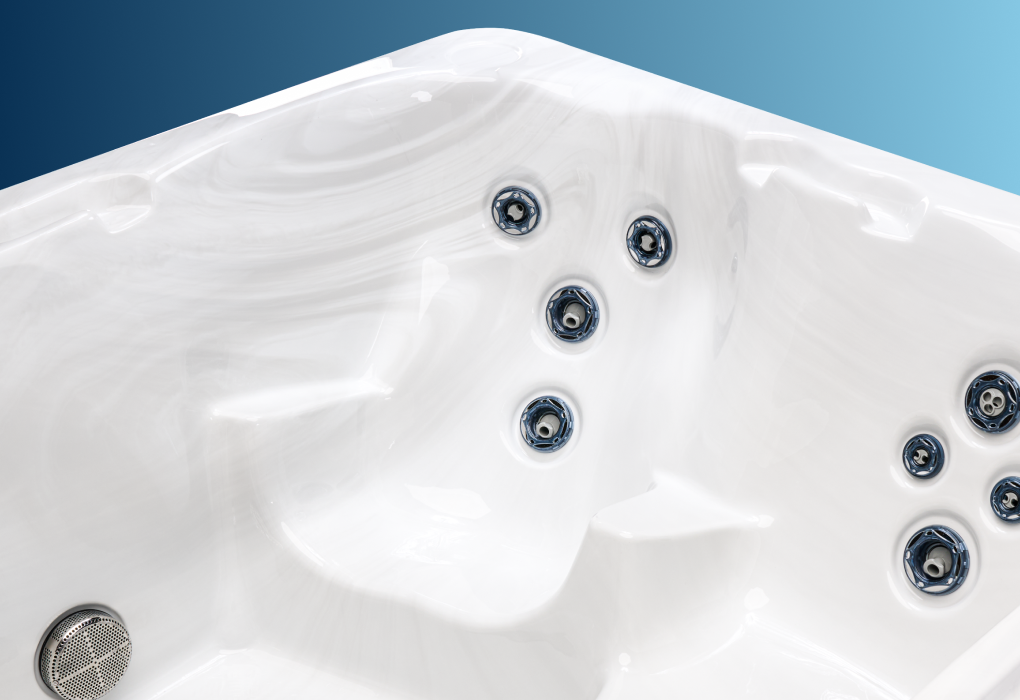 the inside of a hot tub with white acrylic showing the seating