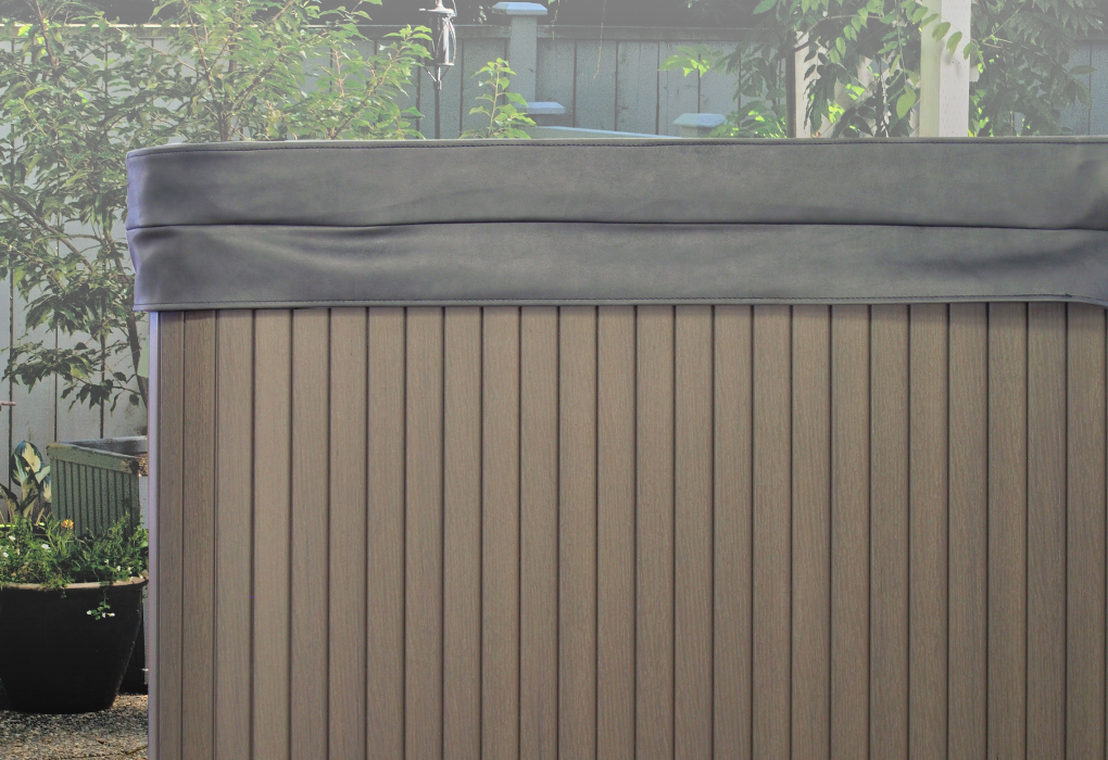 side shot of a beachcomber hot tub with a cover
